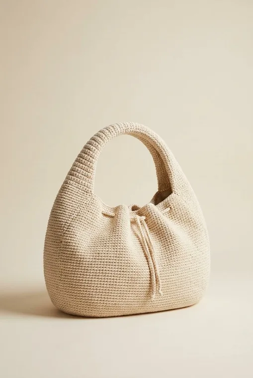 Finished structured crochet crescent handbag