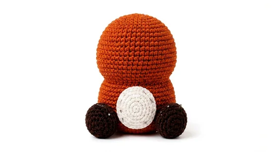 crochet red panda mushroom pattern step 13: Attach belly patch and back legs