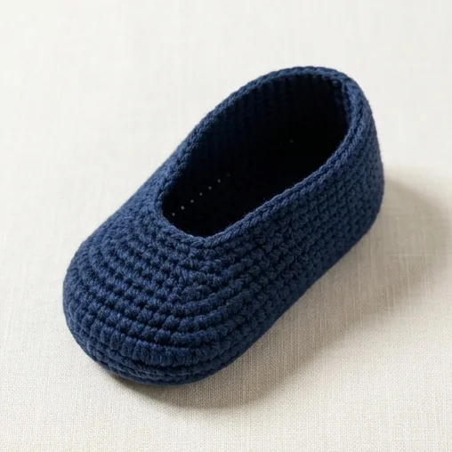 AI concept of a plain navy bear baby booties shoe body before cream trim
