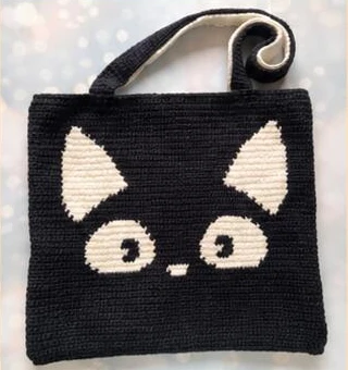 Finished black side of the cat tote with its attached handles