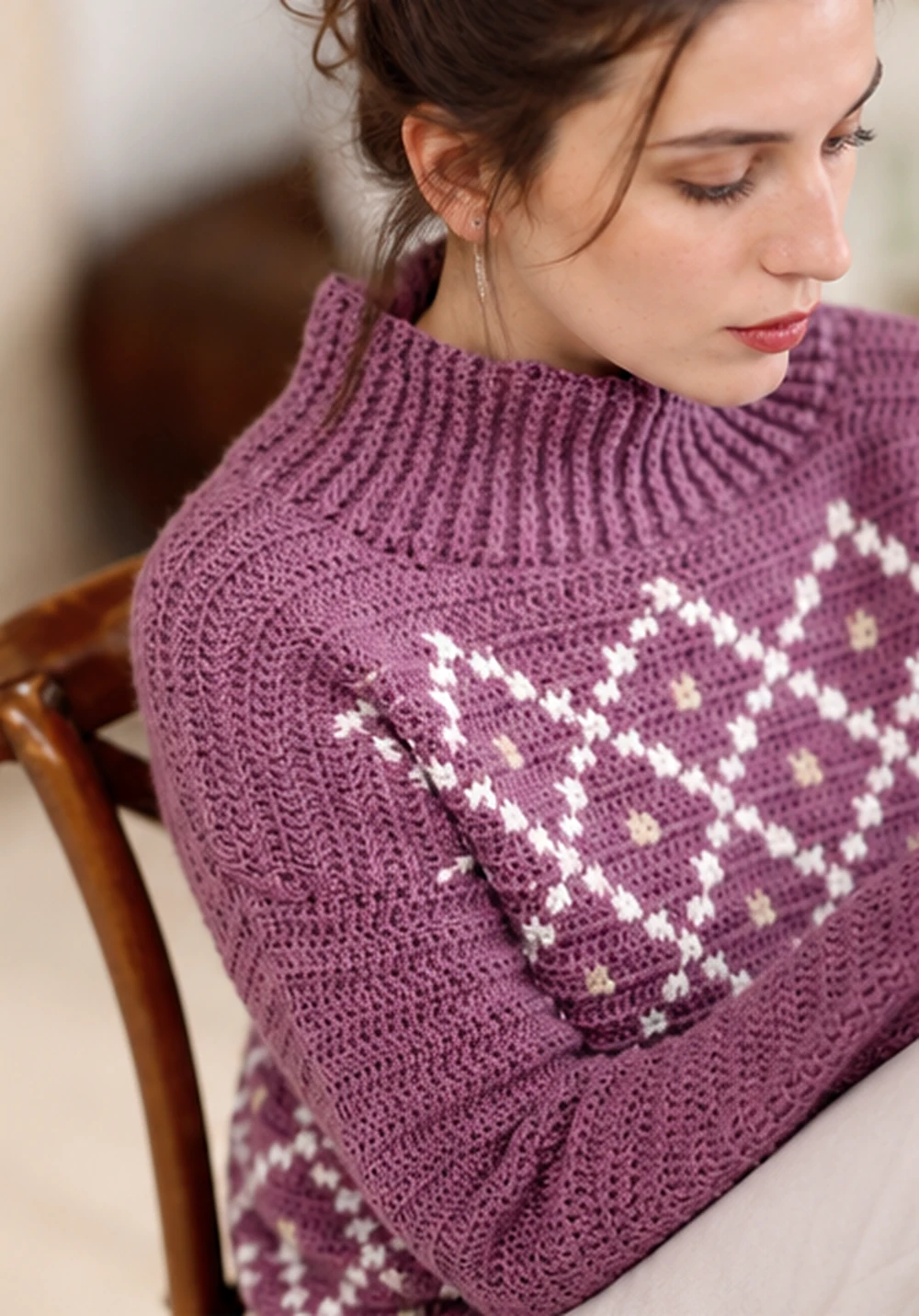 Close view of the cocoon neck crochet sweater collar and diamond stitch detail