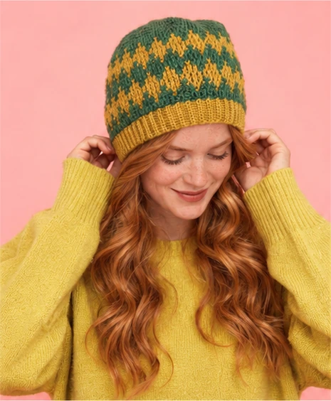 Original crochet diamond hat pattern worn with a gold sweater