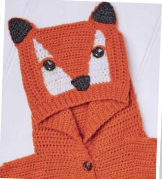 Crochet fox hoodie hood detail showing white face panels and dark ears