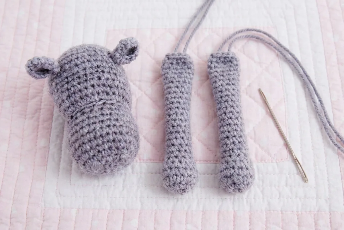 Hippo lovey crochet pattern step 3 two gray arms prepared for sewing
