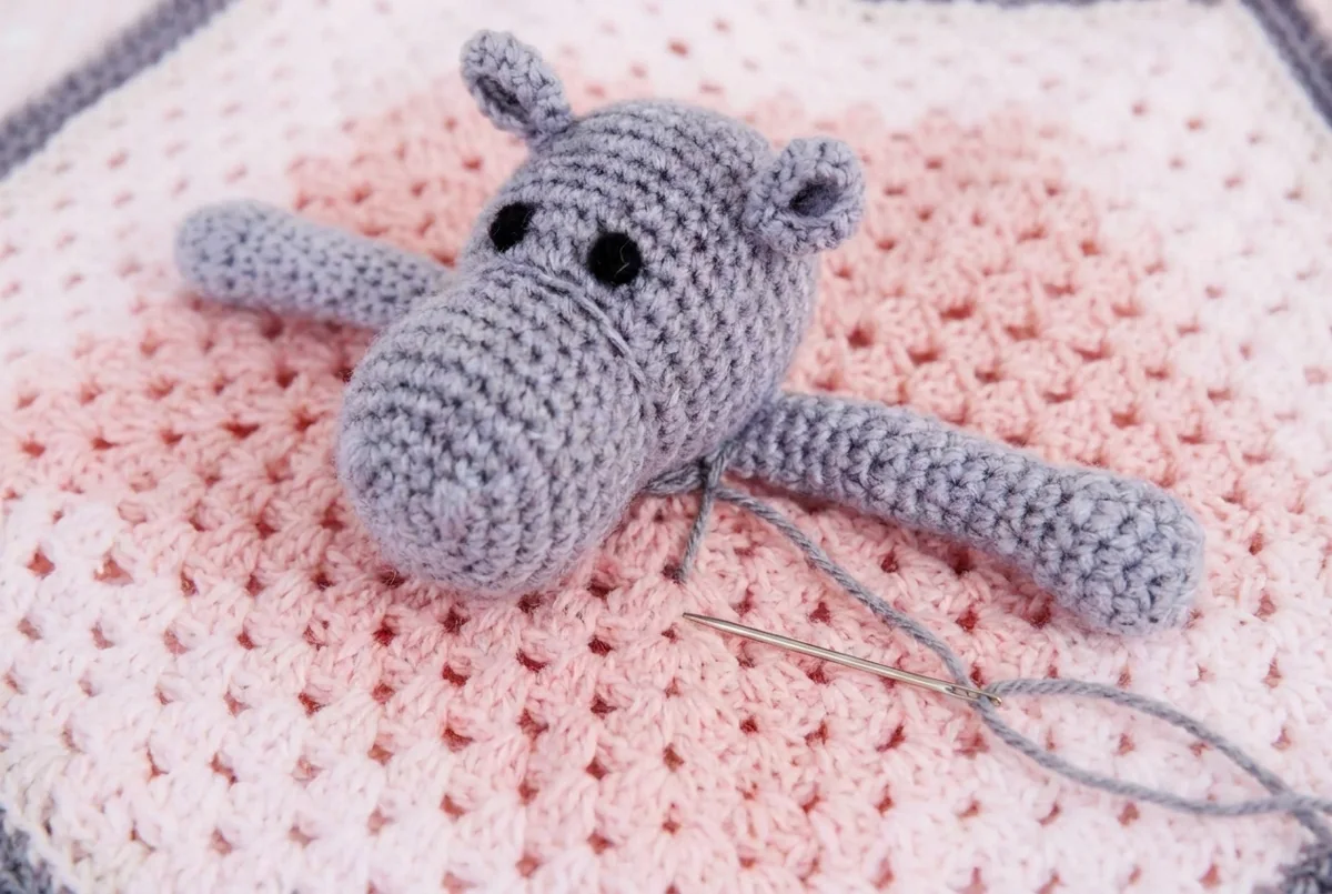 Hippo lovey crochet pattern step 5 sewing the head onto the blanket