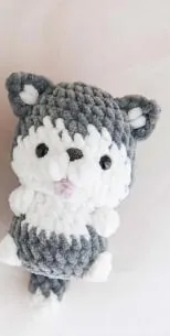 Grey and white crochet husky with a white chest