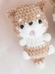 Tan and white crochet Shiba puppy with upright ears