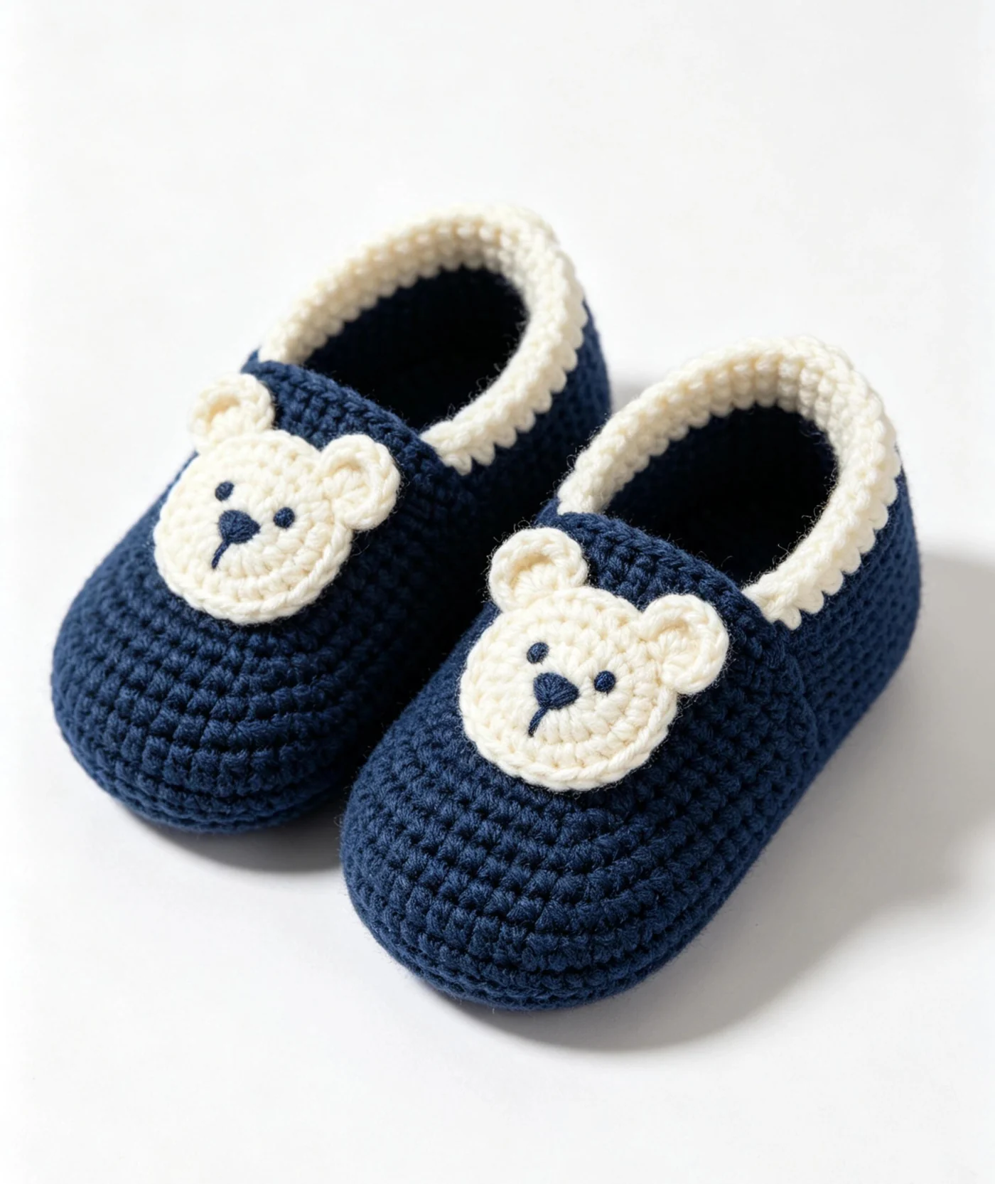Navy bear baby booties with cream bear faces and scalloped opening trim
