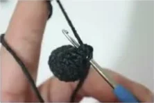 Black panda leg being held open during construction
