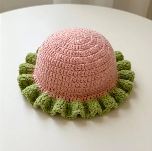 AI concept of a pink crochet ruffle hat with green ruffled brim before its face