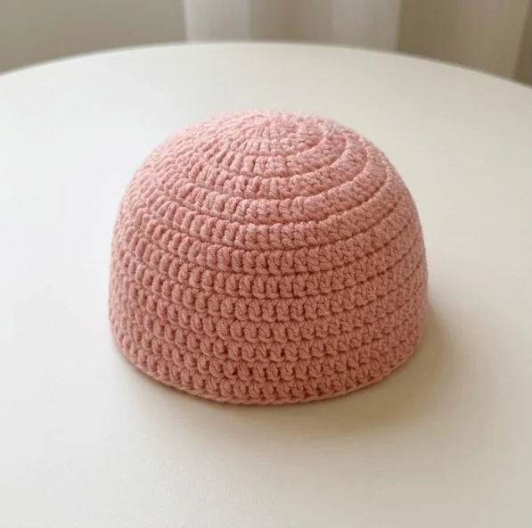 AI concept of a pink crochet ruffle hat crown before adding its brim