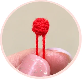 Red crochet berry and leaf assembly, process photograph 5