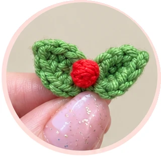 Red crochet berry and leaf assembly, process photograph 6