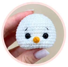 Snowman face with black eyebrows and eyelid details