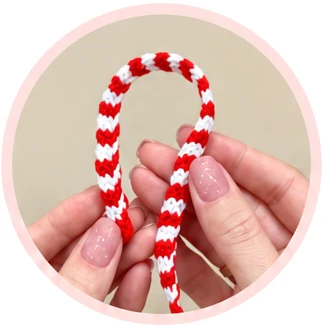 Narrow red-and-white striped crochet scarf