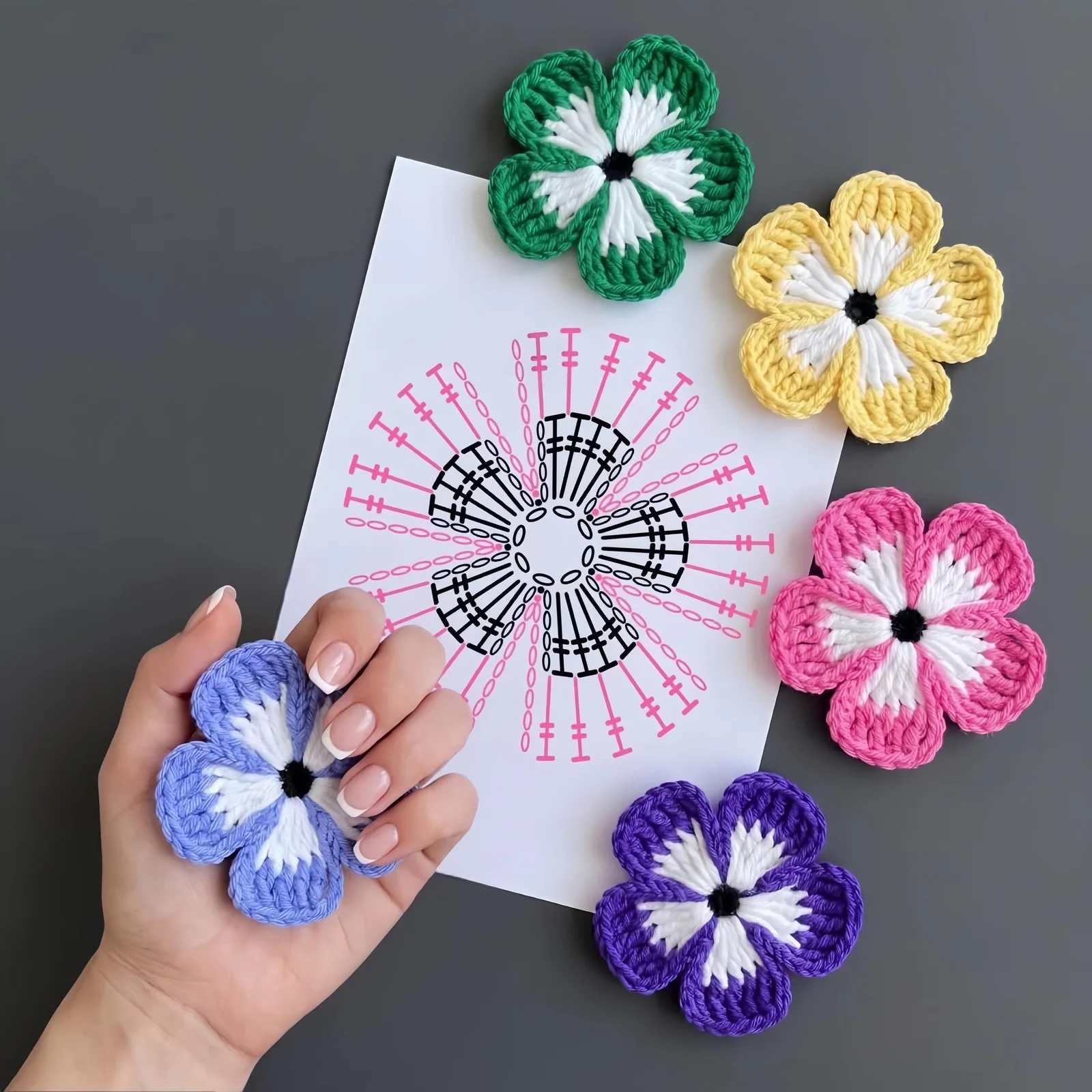 Two-tone five-petal crochet flower chart with green yellow pink and purple samples